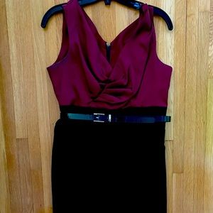 Wine colored dress with black fitted bottom. Can be worn with or without belt .